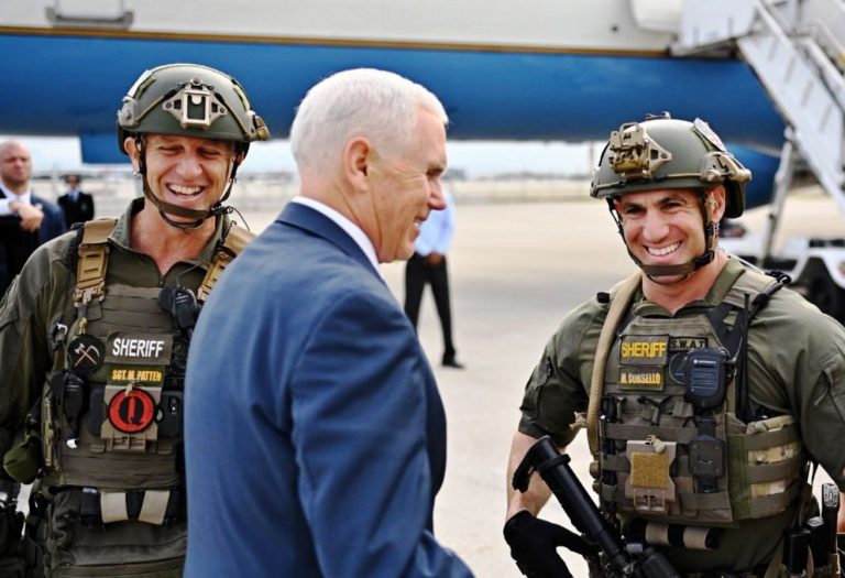 Pence posing with QAnon police crop